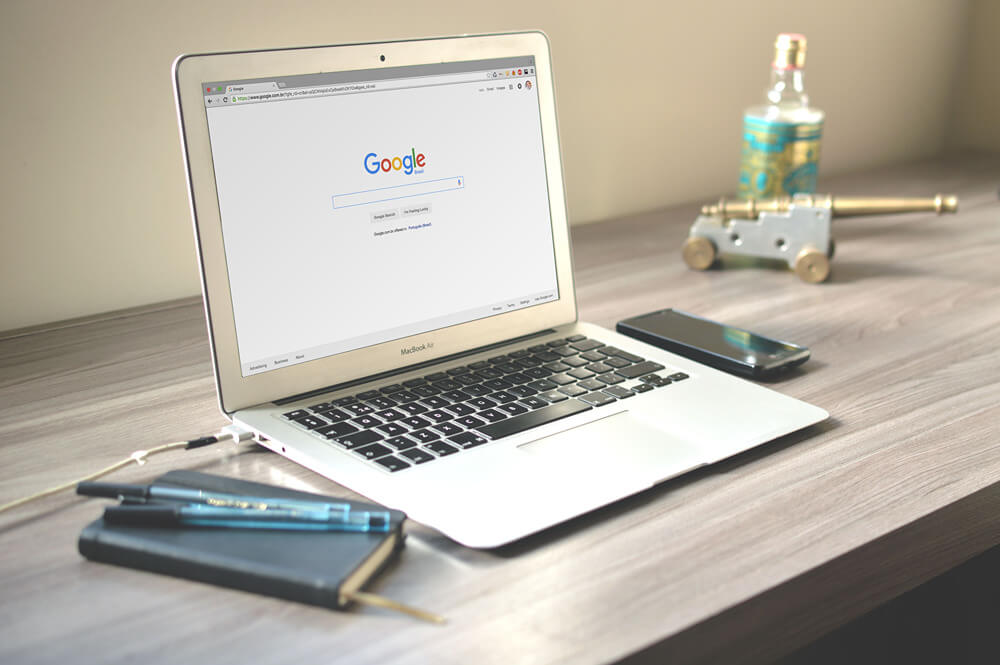 An open laptop with the Google homepage displayed