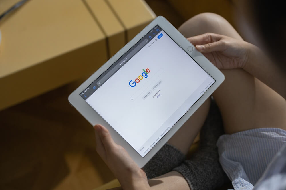 Google homepage on a laptop screen to highlight paid media
